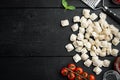 Raw Ravioli ingredients, on black wooden table background , top view flat lay , with copyspace  and space for text Royalty Free Stock Photo