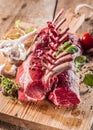 Raw Rectangle Rack of Lamb Chops on Wooden Board Royalty Free Stock Photo