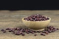 Raw red beans seed in wooden bowl on wooden table background Royalty Free Stock Photo