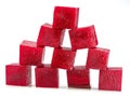 Raw red beetroot cubes arranged as pyramid isolated on white background Royalty Free Stock Photo
