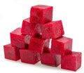 Raw red beetroot cubes arranged as pyramid isolated on white background
