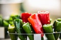 Raw red and green organic peppers in a glass bowl ready to cook Royalty Free Stock Photo