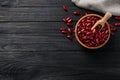 Raw red kidney beans with bowl, scoop and napkin on dark wooden table, flat lay. Space for text Royalty Free Stock Photo