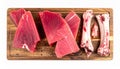 Raw Red Tuna Steak and Bones on a Rustic Wooden Cutting Board Overhead View Royalty Free Stock Photo