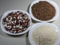 Raw red and white beans, raw buckwheat grains, uncooked rice. Royalty Free Stock Photo