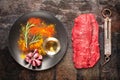 Raw Ribeye steak entrecote on vintage background. top view