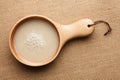 Raw rice and rice water are in wooden dishes. Royalty Free Stock Photo