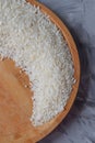 Raw rice in a wooden plate Royalty Free Stock Photo