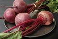 Raw ripe beets on metal platter, closeup