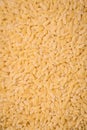 Raw risoni pasta made from durum wheat on a dark concrete background Royalty Free Stock Photo