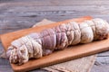 Raw roasted pork roll stuffed with vegetables and garlic Royalty Free Stock Photo