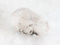 raw rock-crystal of quartz gemstone on white