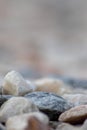 Raw rocks and minerals as natural stones background with crushed and rough material at a rough coast or rocky beach show nuggets