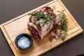 Raw rolled and tied Herdwick Sheep lamb joint prepared with garlic, rosemary and sea salt Royalty Free Stock Photo