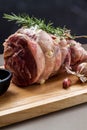 Raw rolled and tied Herdwick Sheep lamb joint prepared with garlic, rosemary and sea salt Royalty Free Stock Photo