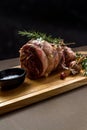 Raw rolled and tied Herdwick Sheep lamb joint prepared with garlic, rosemary and sea salt Royalty Free Stock Photo