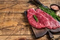 Raw rump cap steak or Picanha steak on wooden board with butcher knife. wooden background. Top view. Copy space Royalty Free Stock Photo