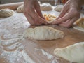 Raw pirozhki with cabbage in the cooking process. Royalty Free Stock Photo
