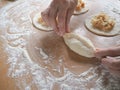 Raw pirozhki with cabbage in the cooking process. Royalty Free Stock Photo