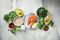 Raw salmon with broccoli, quinoa and avocado on gray background, top view, flat lay. Salmon steak and ingredients Royalty Free Stock Photo