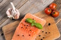 Raw salmon fillet with herbs