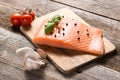 Raw salmon fillet with herbs