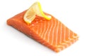 Raw salmon fillet on white. Lemon slice