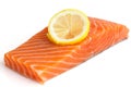 Raw salmon fillet on white. Lemon slice