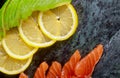 Raw salmon with lemon and avocado on marble plate background Royalty Free Stock Photo