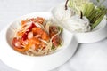 Raw salmon papaya salad served with rice noodle and vegetables Royalty Free Stock Photo