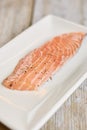 Raw salmon prepared with salt and spices.