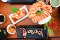 raw salmon, sashimi or sliced salmon and grilled squid Royalty Free Stock Photo