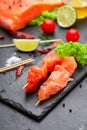 Raw salmon skewers on a stone plate Royalty Free Stock Photo