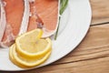 Raw salmon steak on white dish Royalty Free Stock Photo