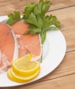 Raw salmon steak on white dish Royalty Free Stock Photo