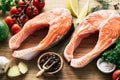 Raw salmon steaks, vegetables and spices ready for cooking Royalty Free Stock Photo