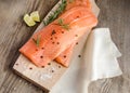 Raw salmon steaks on the wooden board Royalty Free Stock Photo