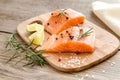 Raw salmon steaks on the wooden board Royalty Free Stock Photo