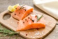 Raw salmon steaks on the wooden board Royalty Free Stock Photo