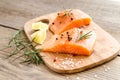 Raw salmon steaks on the wooden board Royalty Free Stock Photo