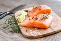 Raw salmon steaks on the wooden board Royalty Free Stock Photo