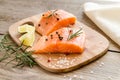 Raw salmon steaks on the wooden board Royalty Free Stock Photo