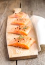 Raw salmon steaks on the wooden board Royalty Free Stock Photo