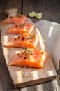 Raw salmon steaks on the wooden board Royalty Free Stock Photo