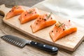 Raw salmon steaks on the wooden board Royalty Free Stock Photo