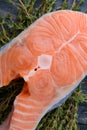 Raw salmon with thyme on a wooden board. close-up Royalty Free Stock Photo