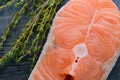Raw salmon with thyme on a wooden board. close-up Royalty Free Stock Photo