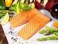 Various Salmon Steaks - Raw Fish Fillet with green Asparagus, Salad and Vegetables Royalty Free Stock Photo