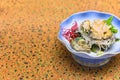 Japanese sashimi of fresh Awabi abalone with algae, radish, shiso and wasabi.