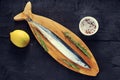 Raw saury on a wooden Board Royalty Free Stock Photo